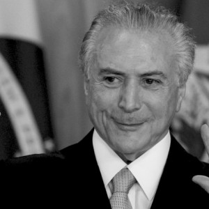 Brazil's acting President Michel Temer arrives to speak in Planalto presidential palace in Brasilia, Brazil, Thursday, May 12, 2016, after the Senate voted to suspend President Dilma Rousseff pending an impeachment trial. In his first words to Brazilians as acting president, the former vice president said his priority will be reviving Latin America's largest economy. (AP Photo/Felipe Dana)